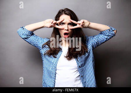 Funny lifestyle portrait of crazy girl closed her eyes,emotional and happy mood Stock Photo