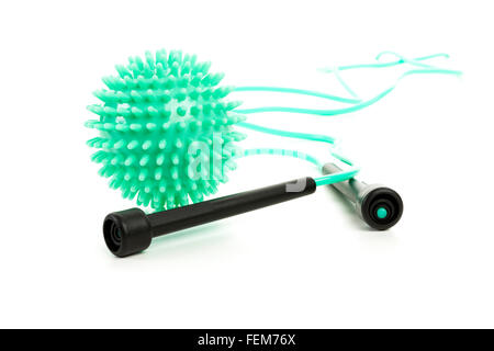 massage ball and skipping rope on white background Stock Photo