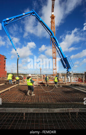 construction workers pouring concrete Stock Photo