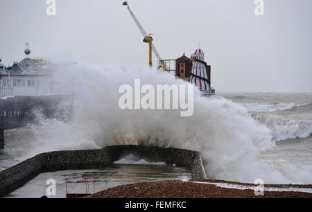 Brighton, UK. 8th February, 2016. UK Weather: Huge waves break over Brighton seafront at high tide by the pier as Storm Imogen batters the south coast today with the weather forecast predicting wind speeds of up to 90 mph causing widespread flooding and damage  Credit:  Simon Dack/Alamy Live News Stock Photo