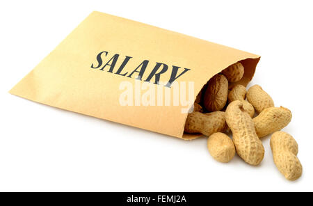 Peanuts falling out of an envelope marked salary isolated on a white background Stock Photo