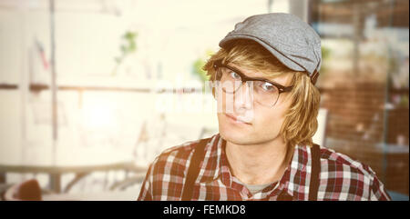 Composite image of serious blond hipster staring Stock Photo