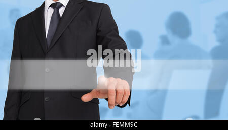 Composite image of businessman pointing Stock Photo