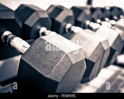 Rack of hand free weight dumbbells at a healthclub gym Stock Photo