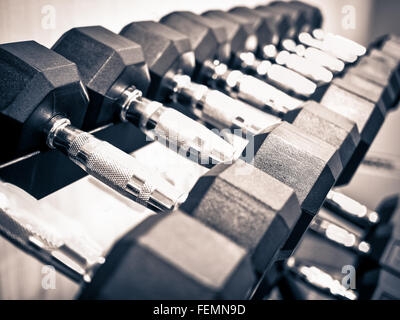 Rack of dumbbell hand free weights at a healthclub gym Stock Photo