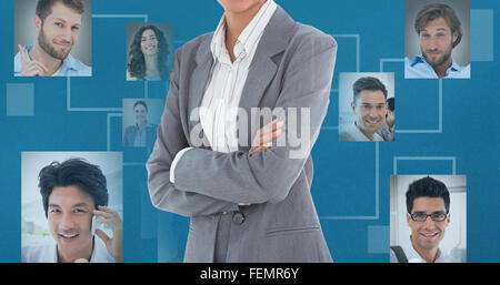 Composite image of portrait of smiling businesswoman standing arms crossed Stock Photo
