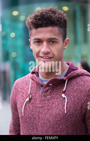 Portrait of an attractive, young, mixed-race man in the city Stock Photo