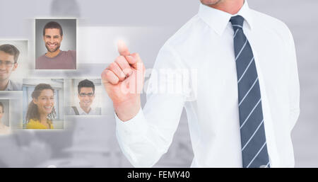 Composite image of businessman pointing with his finger Stock Photo