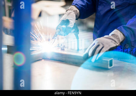 Welder welding steel in factory Stock Photo