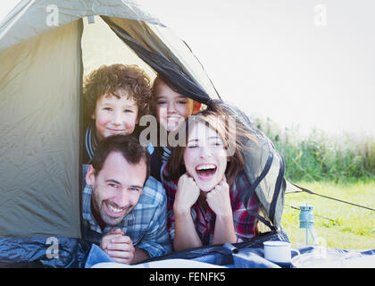 Portrait smiling family in tent Stock Photo
