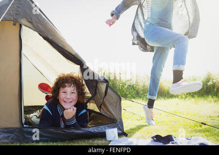 Portrait smiling boy inside tent Stock Photo