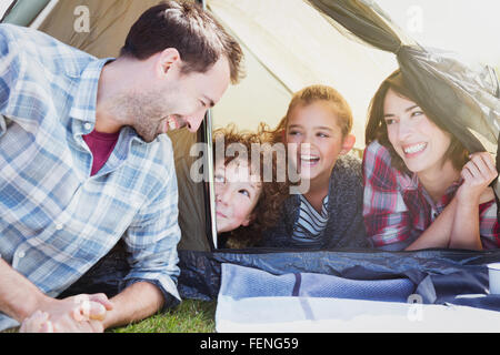 Smiling family in tent Stock Photo