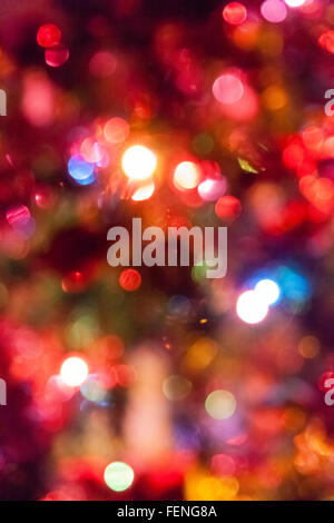 Colorful Christmas lights on a tree created a beautiful, blurred bokeh Stock Photo