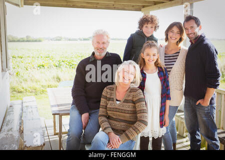 Portrait smiling multi-generation family on porch Stock Photo