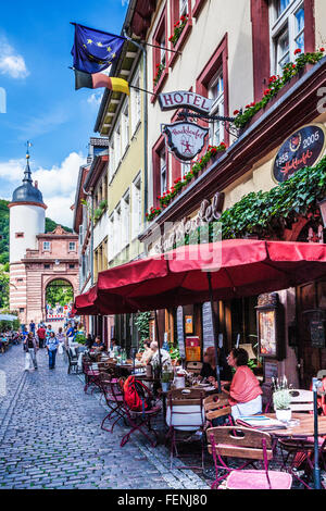 Steingasse, a pretty cobbled street in the Altstadt quarter of Heidelberg with the gate of the Alte Brucke at its end. Stock Photo