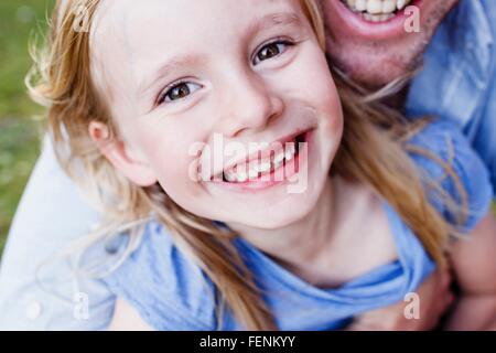 Cropped close up of father and daughter in park Stock Photo