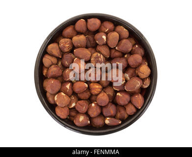 Hazelnuts in a bowl, isolated on white Stock Photo