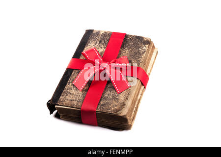 old vintage book in a gift ribbon isolated on white Stock Photo