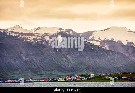 Hrisey, North Iceland, Iceland. 1st Aug, 2015. Evening sky aglow over HrÃsey, known as the Pearl of EyjafjÃ¶rÃ°ur, off the north coast of Iceland, 35 km north of Akureyri, in the middle of fjord EyjafjÃ¶rÃ°ur, surrounded by spectacular snow covered mountains. Second-largest island (after Heimaey in the South), and continuously inhabited since the Settlement of Iceland, it was originally a fishing industry base. Now a bird-watching destination, with no natural predators, it is an ideal bird sanctuary. Tourism has become a growing sector of the economy and Iceland has become a favorite tourist Stock Photo