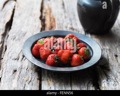 Strawberries in metal bowl Stock Photo