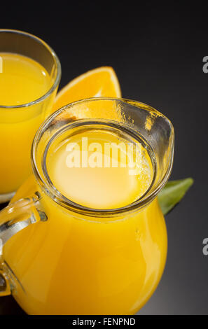 orange juice and fruit on black background Stock Photo