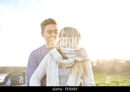 Happy young couple on date at beach Stock Photo