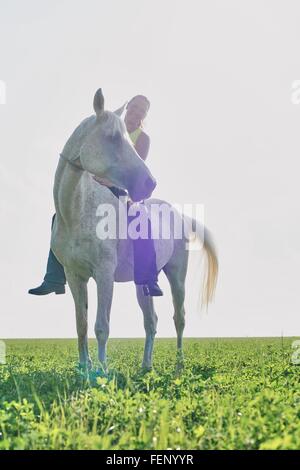 Portrait of a woman riding a horse bareback, France Stock Photo - Alamy