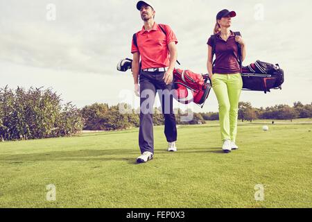 Golfers walking on course, Korschenbroich, Dusseldorf, Germany Stock Photo
