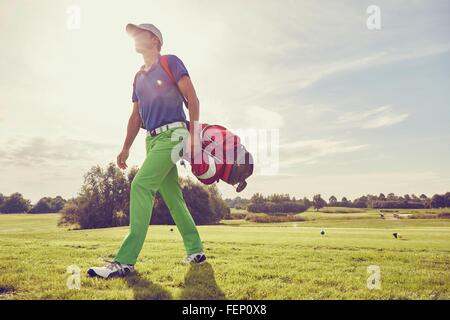 Golfer walking on course, Korschenbroich, Dusseldorf, Germany Stock Photo