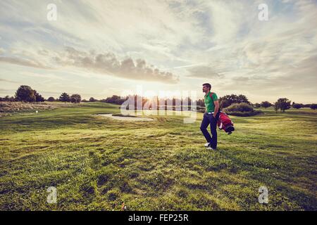 Golfer walking on course, Korschenbroich, Dusseldorf, Germany Stock Photo