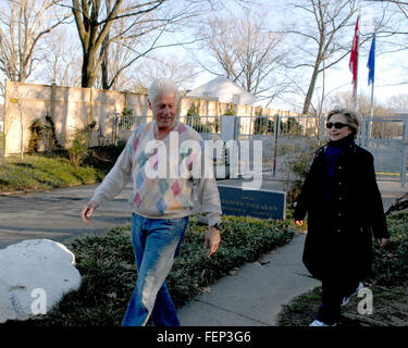 United States Senator Hillary Rodham Clinton (Democrat of New York), right, is smiling after her primary victories in Ohio, Rhode Island, and Texas last evening after she and her husband, former United States President Bill Clinton, left, return from a late afternoon walk near their home in Washington, DC on Wednesday, March 5, 2008. Credit: Ron Sachs/CNP (RESTRICTION: NO New York or New Jersey Newspapers or newspapers within a 75 mile radius of New York City) Stock Photo