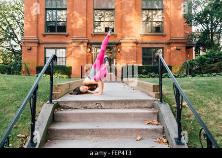 Woman in Side Crow pose (Parsva Bakasana) Stock Photo