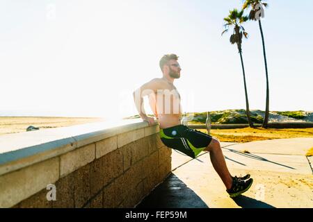 Young man exercising outdoors Stock Photo