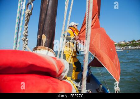 Senior man on sailing boat Stock Photo