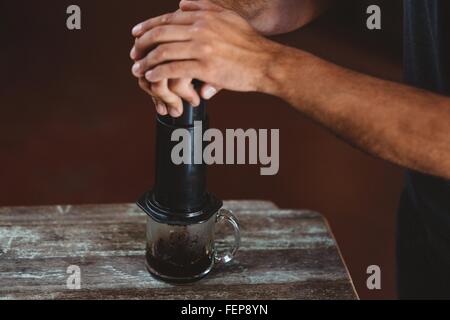 Aeropress Coffee and Glass Pot Close-up: Barista Press To Device and Coffee  Drops Pours Trought Aeropress To Pot Stock Photo - Image of method, coffee:  222093800