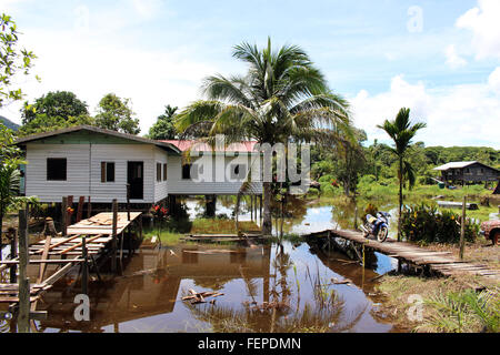 GUNUNG MULU/MALAYSIA - CIRCA NOVEMBER 2015: Palafitte houses on a flooded terrain outside of Gunung Mulu national park in Borneo Stock Photo