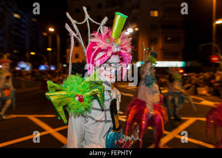 Characters, dancers and floats at the opening parade of the Carnaval de Santa Cruz de Tenerife. Thousands of people in groups of Stock Photo