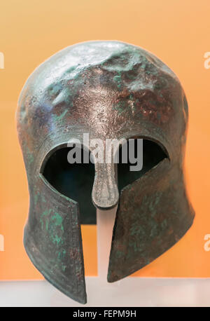 Delphi, Phocis, Greece.  Delphi Archaeological museum.  Votive bronze Corinthian style helmet dating from 7th century BC. Stock Photo