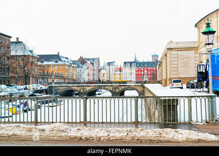 COPENHAGEN, DENMARK - JANUARY 5, 2011: Waterfront and bridges in Copenhagen in winter. Copenhagen is the capital and most populated city of Denmark. It connects the North sea with the Baltic sea. Stock Photo