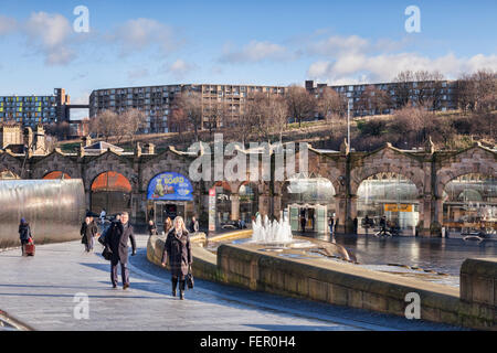 People walking through the forecourt at Sheffield Station, South Yorkshire, England, UK, on a sunny winter day. Stock Photo