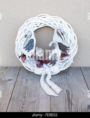 Easter homemade decorated wreath decoration on the table. Homemade arrangement. Stock Photo