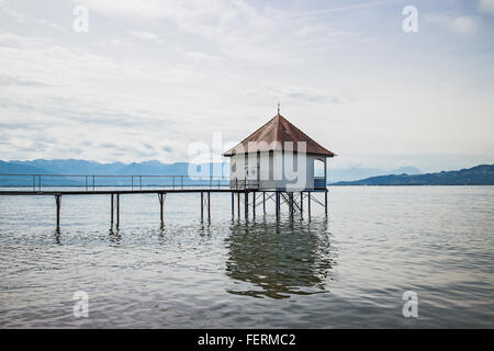 View over Lake Constance with the Swiss and Austrian Alps in the background near the City of Lindau, Bavaria, Germany Stock Photo