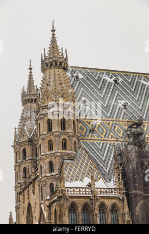 A closeup to part of St. Stephen's Cathedral (Stephansdom) in Vienna during the winter. Snow can be seen on the building. Stock Photo