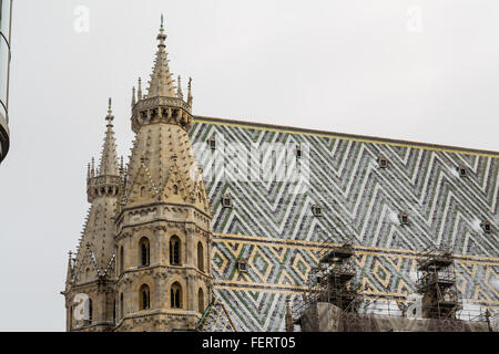 A closeup to part of St. Stephen's Cathedral (Stephansdom) in Vienna during the winter. Snow can be seen on the building. Stock Photo