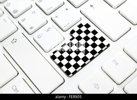 Gran Prix motor race finish chess flag concept, enter button or key on white keyboard Stock Photo