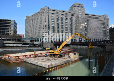 Landfill construction in 2016 on the extension of Chicago's Riverwalk along Wacker Drive is underway in front of the Merchandise Mart.