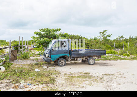 A typical old, battered truck in a poor area in the south of Barbuda, Antigua and Barbuda, West Indies Stock Photo