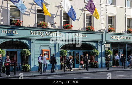 Front entrance to the Mercantile Tavern in Dame Street, Dublin, Republic of Ireland, with pedestrians on the pavement. Stock Photo