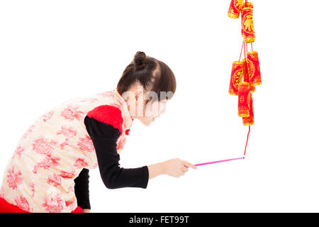 happy chinese new year. kids playing with firecracker Stock Photo