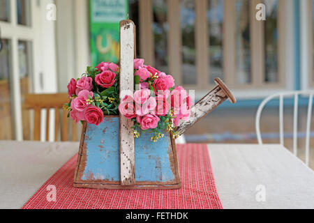 colorful of rose artificial flower in flowerpot Stock Photo